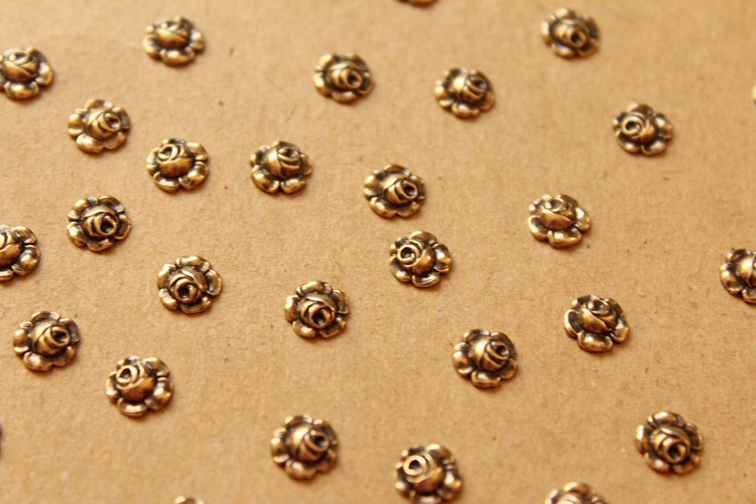 12 pc. Antique Brass Plated Tiny Raw Brass Roses: 7mm diameter - made in USA | AB-007
