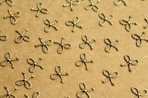8 pc. Tiny Antique Brass Plated Braided Tied Bows: 7mm by 6.5mm - made in USA | AB-172