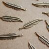 8 pc. Antique Brass Plated Feathers: 34mm by 8.5mm - made in USA | AB-079