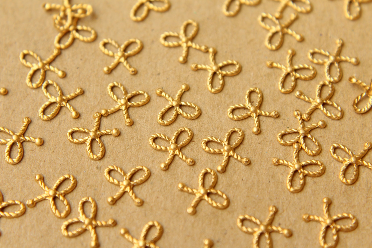 14 pc. Tiny Raw Brass Braided Tied Bows: 7mm by 6.5mm - made in USA | RB-600