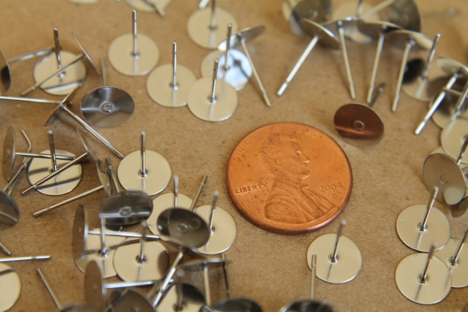 100 pc. Stainless steel earring posts, 8mm pad | FI-097