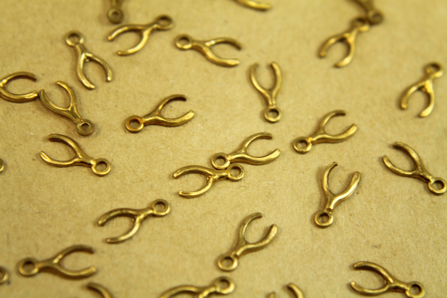 12pc. Tiny Raw Brass Wishbones with Loop: 9.5mm by 5mm - made in USA | RB-365