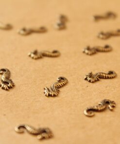 12 pc. Tiny Antique Brass Plated Seahorses: 10mm by 5mm - made in USA | AB-029