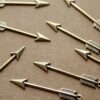 4 pc. Medium Antique Brass Plated Arrows: 33mm by 5mm - made in USA | AB-094