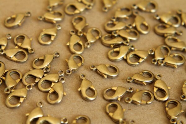 12 pc. Raw Brass Lobster Clasps, 7mm x 12mm | FI-095