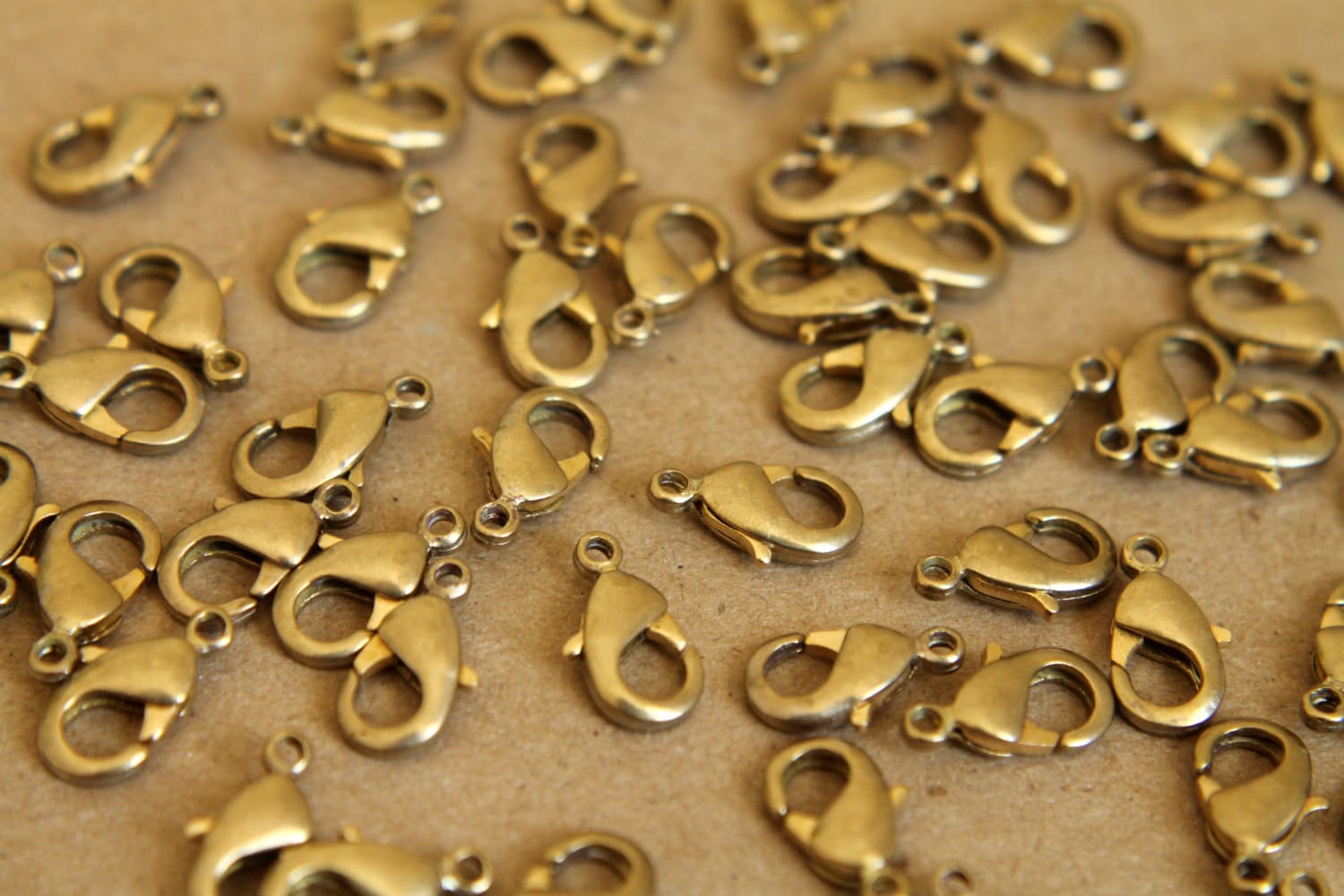 12 pc. Raw Brass Lobster Clasps, 7mm x 12mm | FI-095