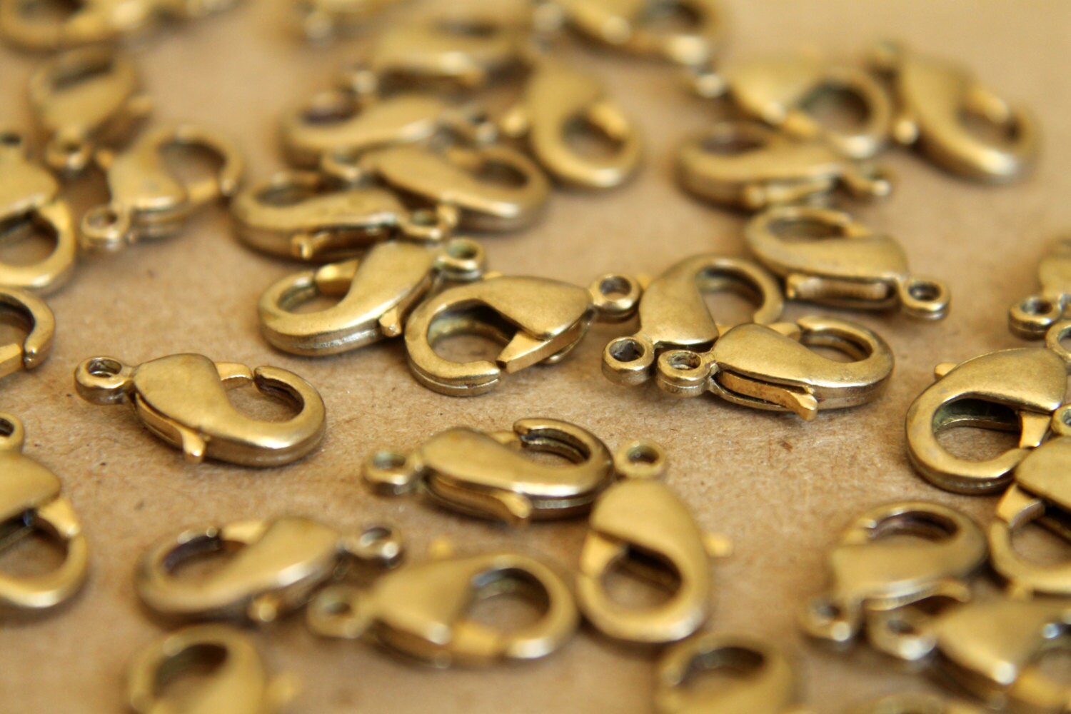 12 pc. Raw Brass Lobster Clasps, 7mm x 12mm | FI-095