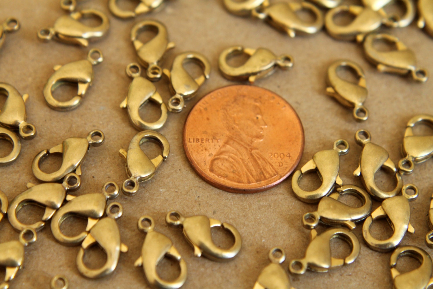 12 pc. Raw Brass Lobster Clasps, 7mm x 12mm | FI-095