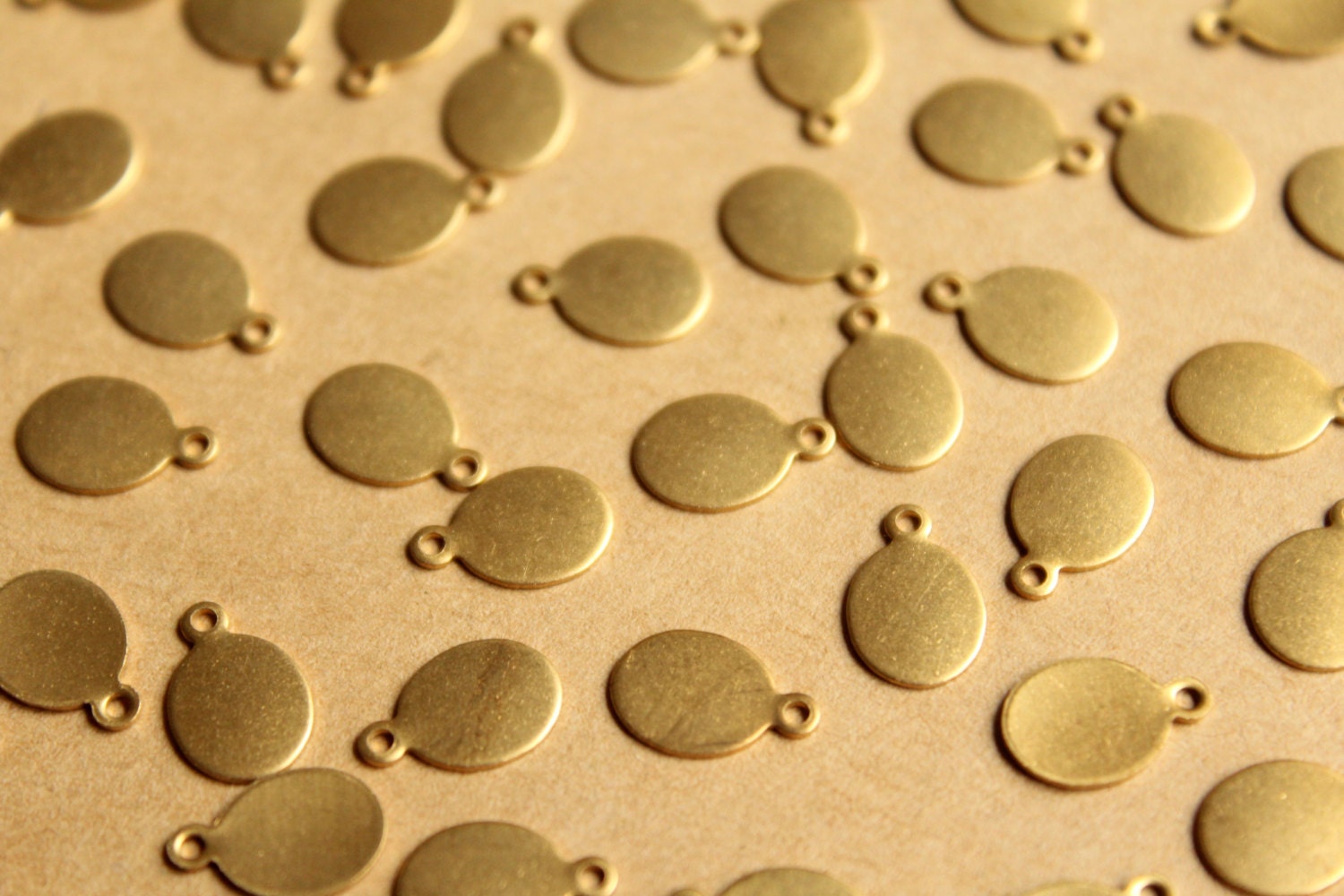 24 pc. Raw Brass Oval Tags: 11mm by 7mm - made in USA | RB-769
