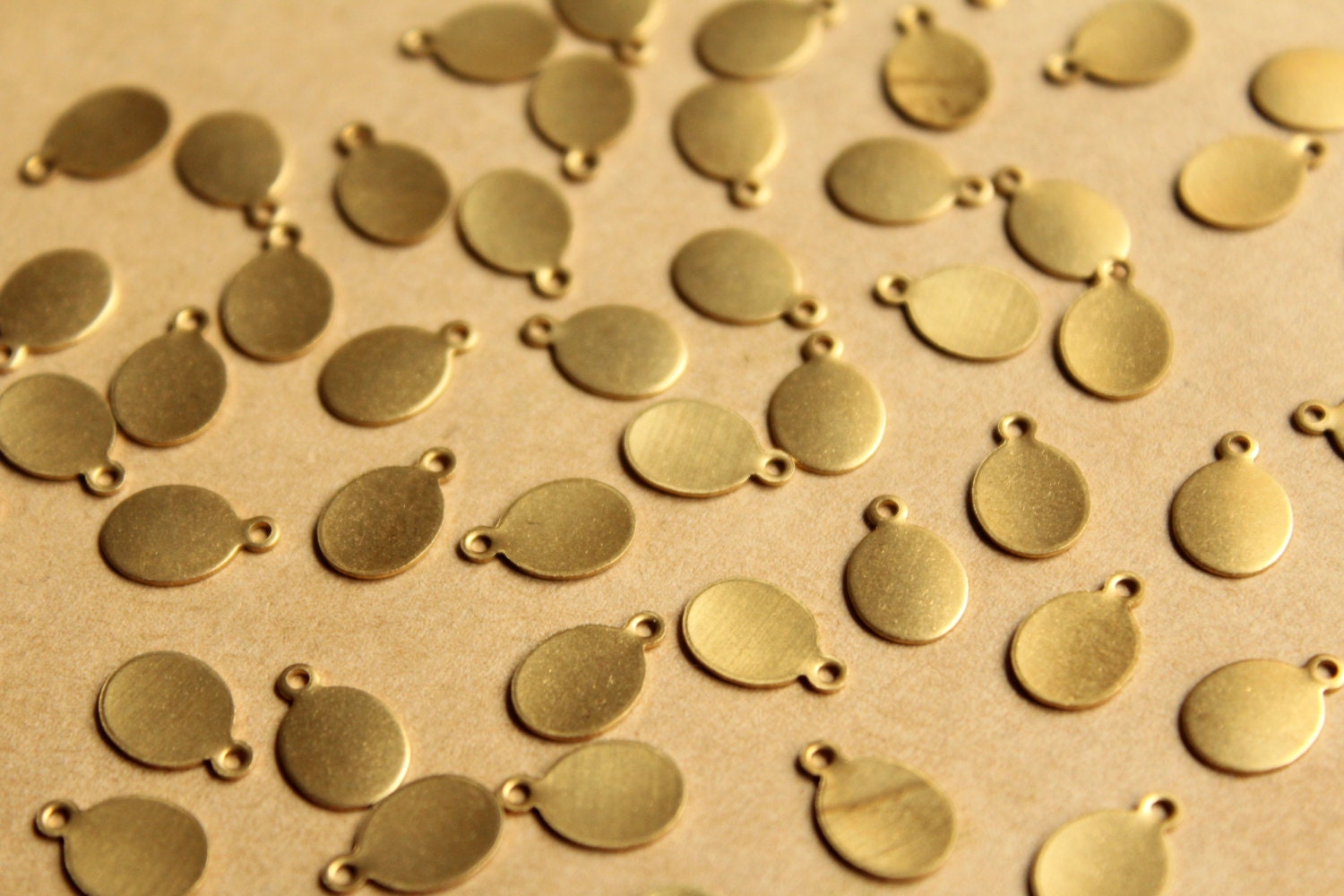 24 pc. Raw Brass Oval Tags: 11mm by 7mm - made in USA | RB-769