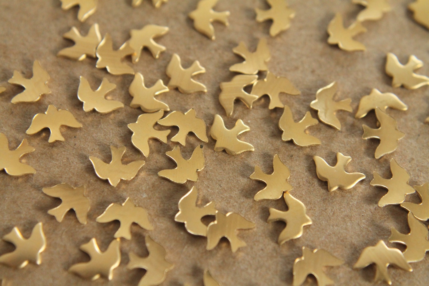 24 pc. Tiny Raw Brass Doves: 8mm by 6mm - made in USA | RB-062